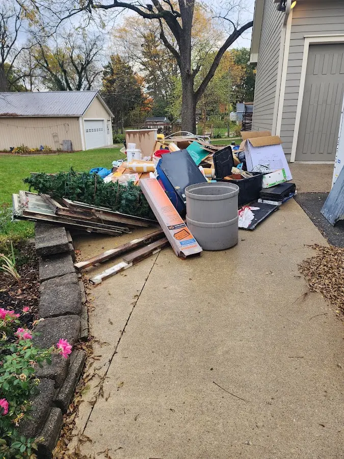 Dumpster being loaded with debris for 30 Yard Dumpster Rental in Mountainside